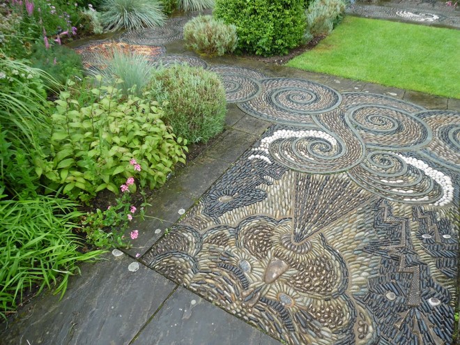 earthy-grayish-colors-pebble-mosaic-garden-decoration-cobblestones-wind-storm-motif