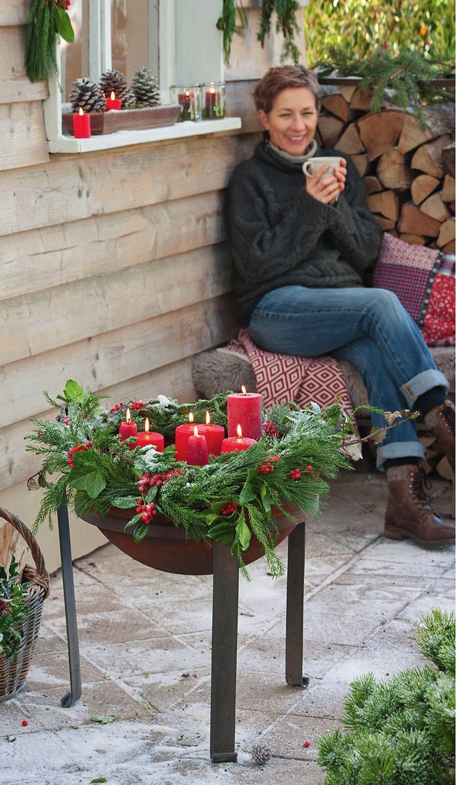 rustic outdoor christmas decor fiery bowl barbecue candle holder between pine branches